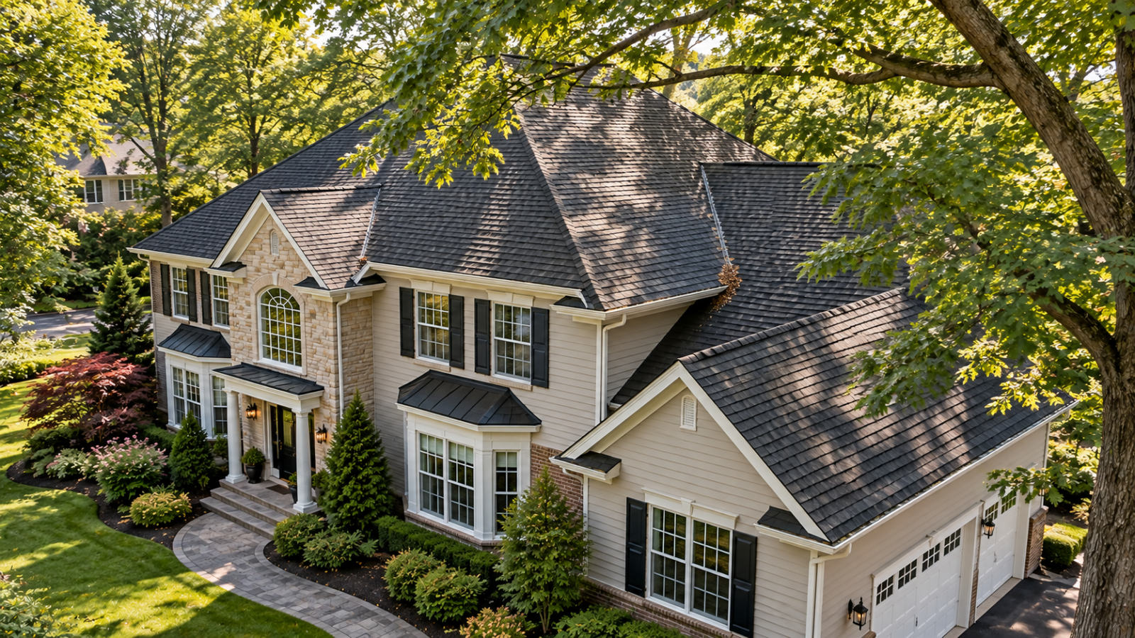 Marlboro, NJ Colonial home with a dark architectural shingle roof surrounded by mature tree cover