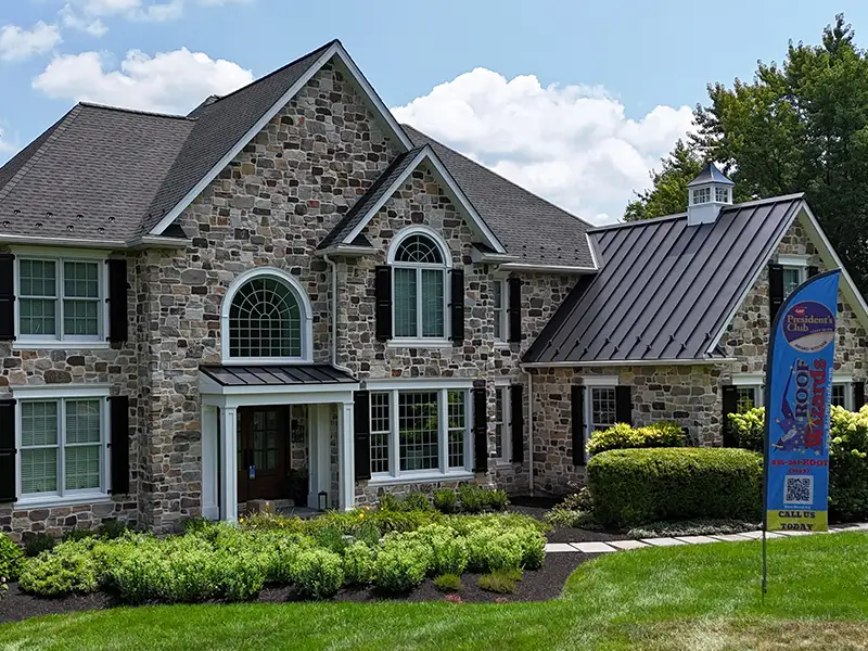 Stone exterior home with metal roof and new shingles